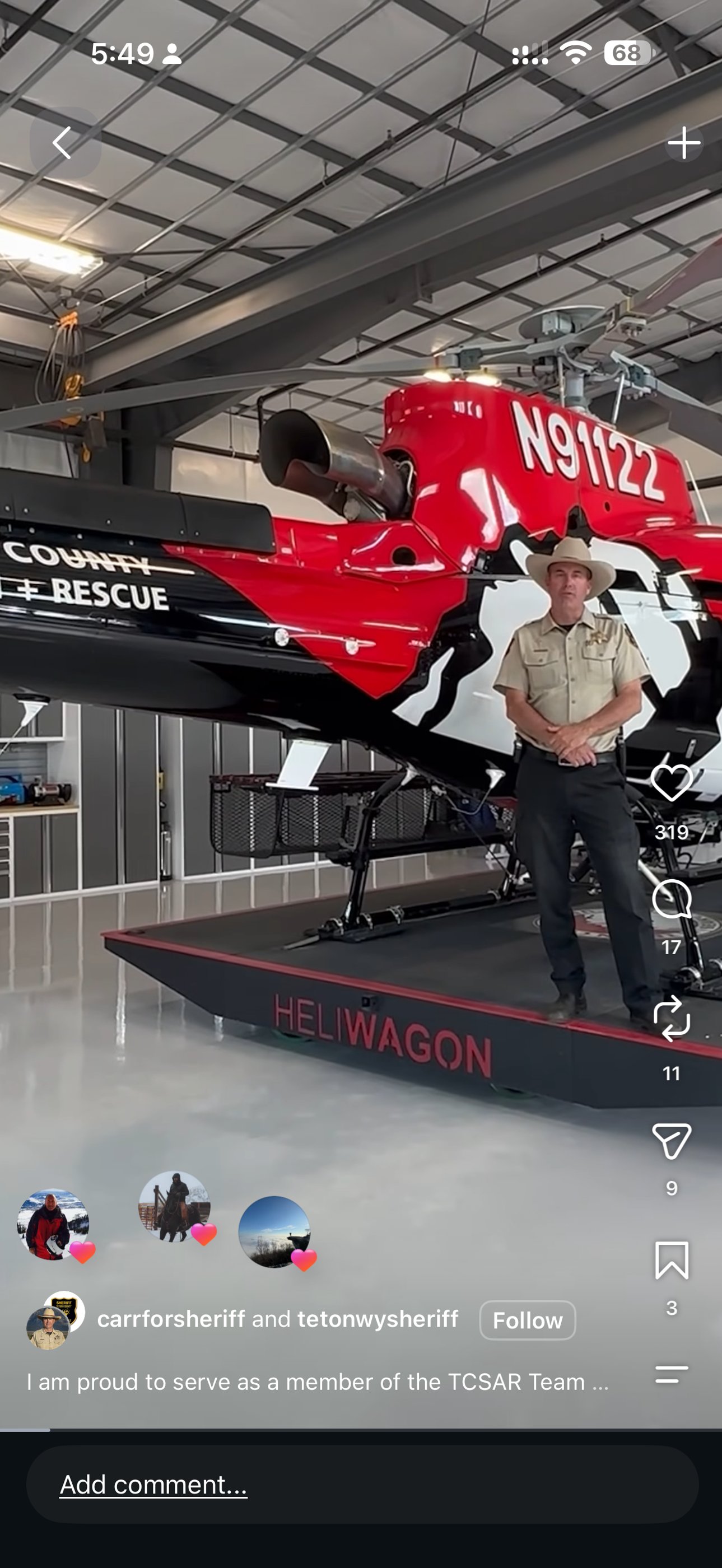 An Instagram collaboration reel by carrforsheriff and tetonwysheriff showing Carr in uniform standing on the County Search and Rescue helicopter platform in the hangar.