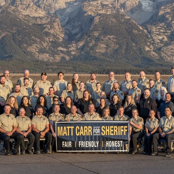 Thumbnail of Exhibit A, the uniformed group photograph with the campaign banner.