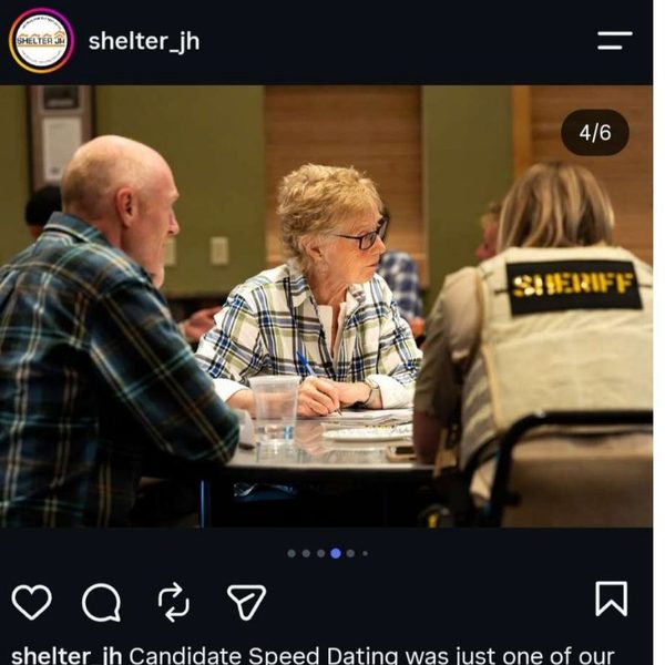 Thumbnail of Exhibit P, a deputy in duty gear seated at the Shelter JH candidate forum.